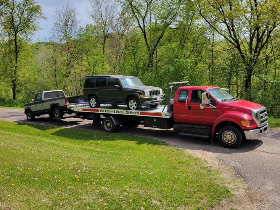 SUV on the back of a tow truck